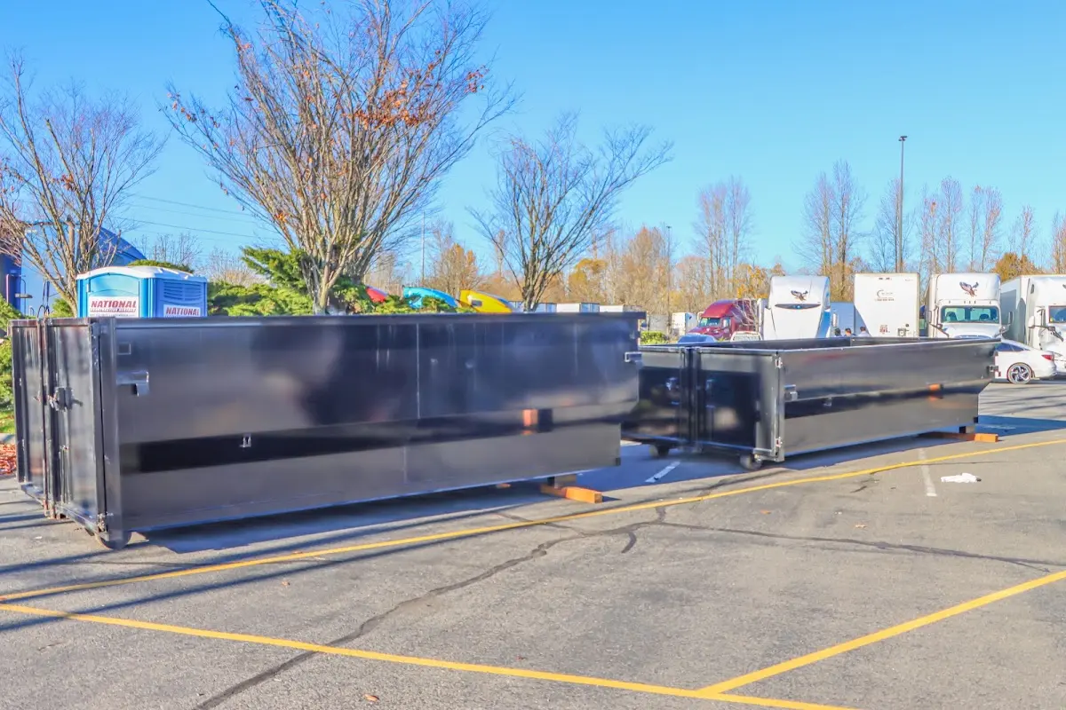 Professional dumpster rental service with roll-off container on residential driveway in Scarsdale